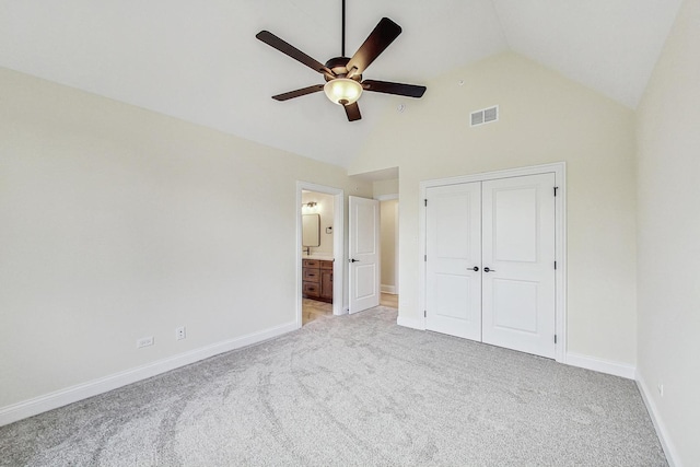 unfurnished bedroom featuring baseboards, a closet, visible vents, and light colored carpet