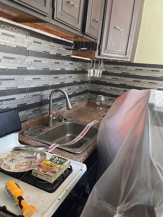 interior details with sink and decorative backsplash