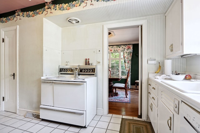 kitchen with white cabinets, white range with electric cooktop, and light hardwood / wood-style flooring