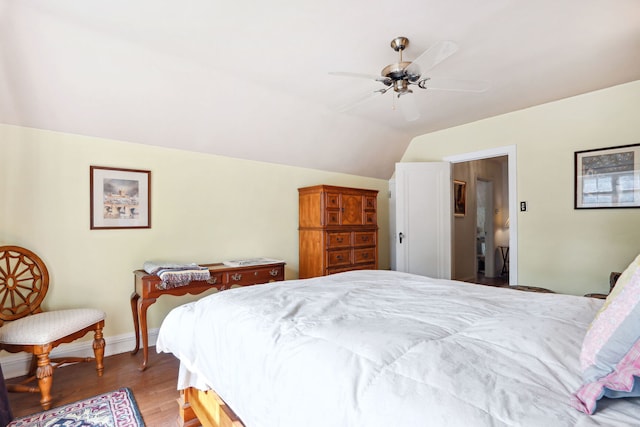 bedroom featuring lofted ceiling, ceiling fan, and dark hardwood / wood-style floors