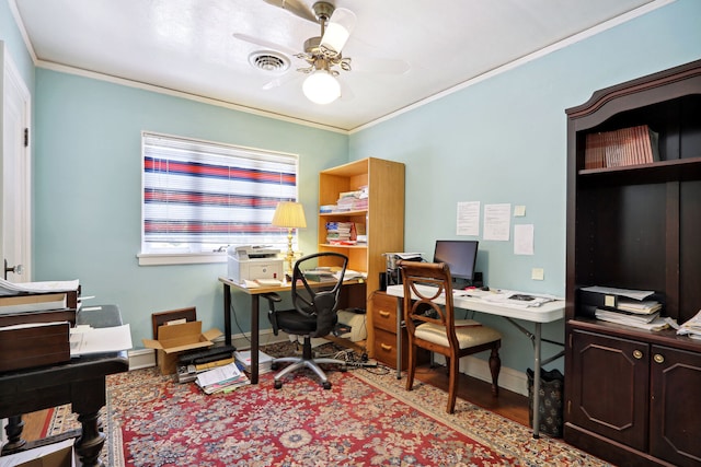 home office featuring ceiling fan, ornamental molding, and light wood-type flooring