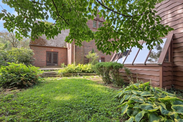 view of yard featuring french doors