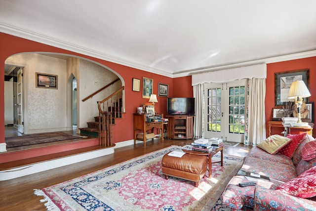 living room featuring ornamental molding and dark hardwood / wood-style flooring