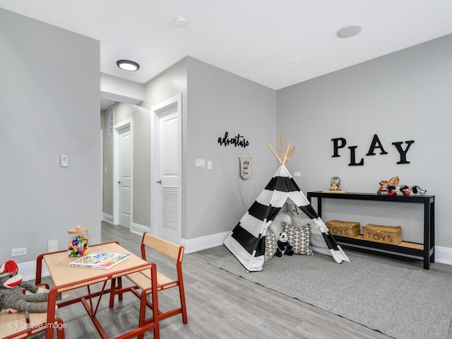 game room with hardwood / wood-style floors