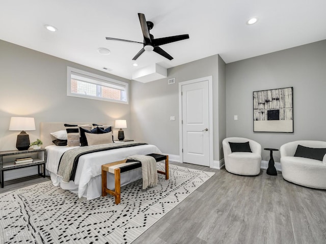 bedroom featuring ceiling fan and light hardwood / wood-style flooring