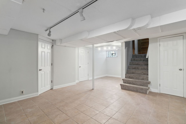 basement with light tile patterned flooring