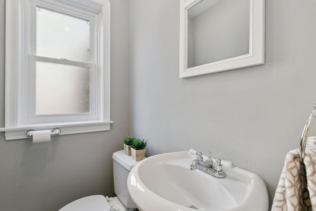 bathroom with toilet and sink