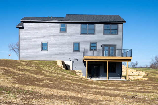 back of property with a patio area and a wooden deck