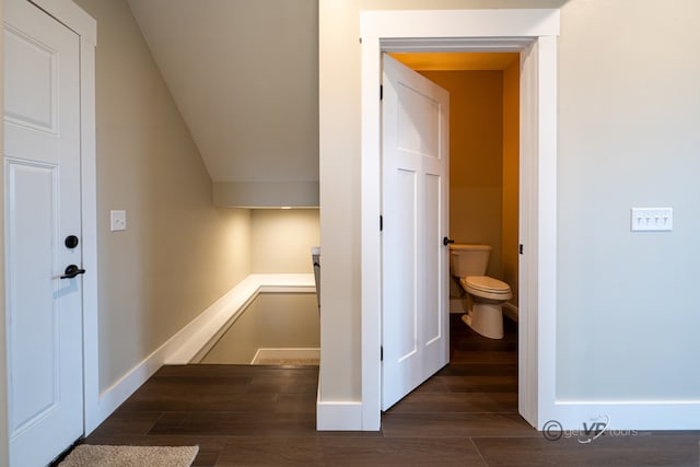 bathroom with hardwood / wood-style flooring and toilet