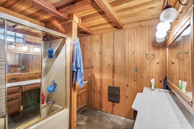 full bath with wooden walls, wooden ceiling, beamed ceiling, combined bath / shower with glass door, and concrete floors