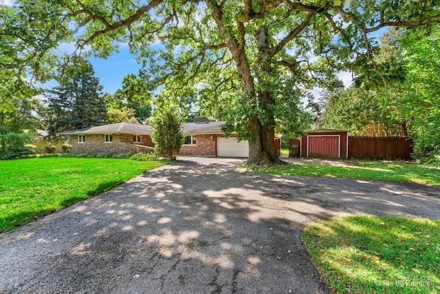 view of front facade with a front lawn and a garage