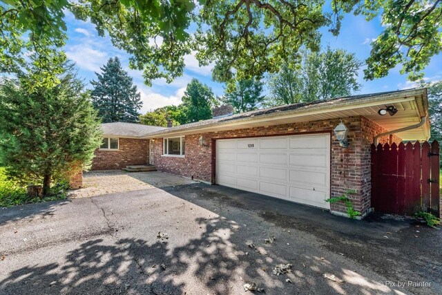 single story home featuring a garage