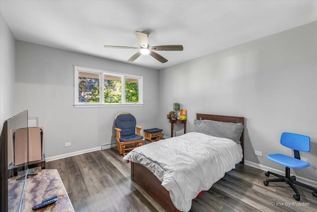 bedroom featuring dark wood finished floors, baseboards, and ceiling fan