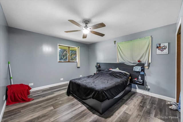 bedroom featuring hardwood / wood-style flooring and ceiling fan