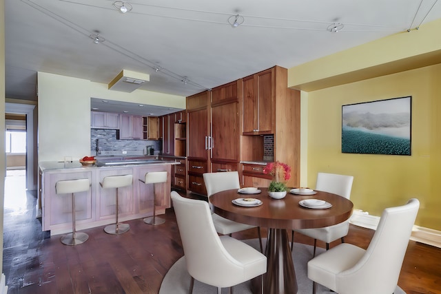 dining space featuring dark hardwood / wood-style flooring