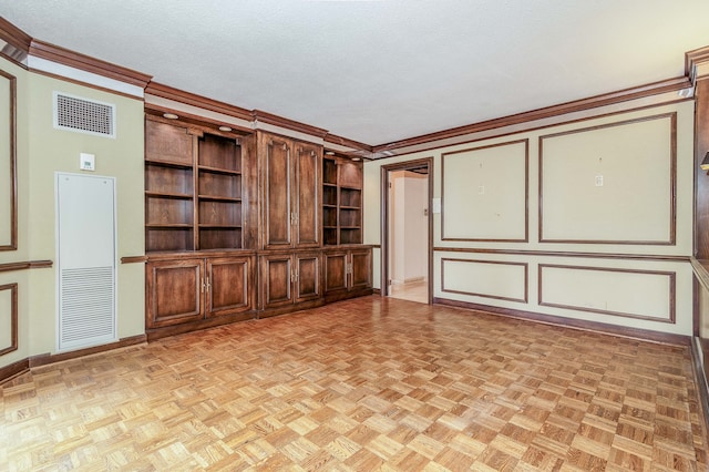 unfurnished living room with a textured ceiling, crown molding, and light parquet flooring