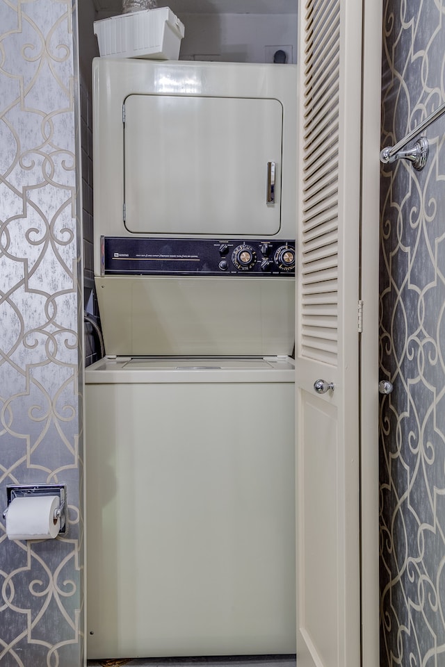 laundry room with stacked washer and dryer