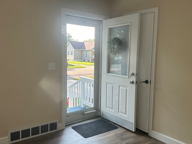 entryway with wood-type flooring