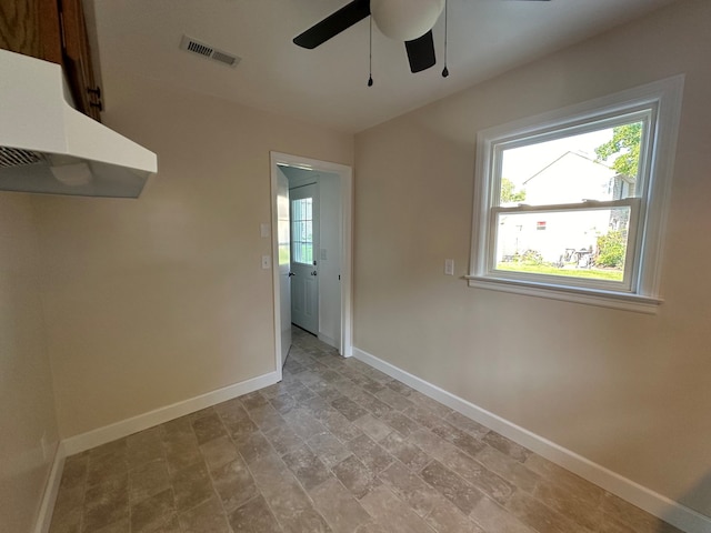 interior space featuring ceiling fan and a healthy amount of sunlight