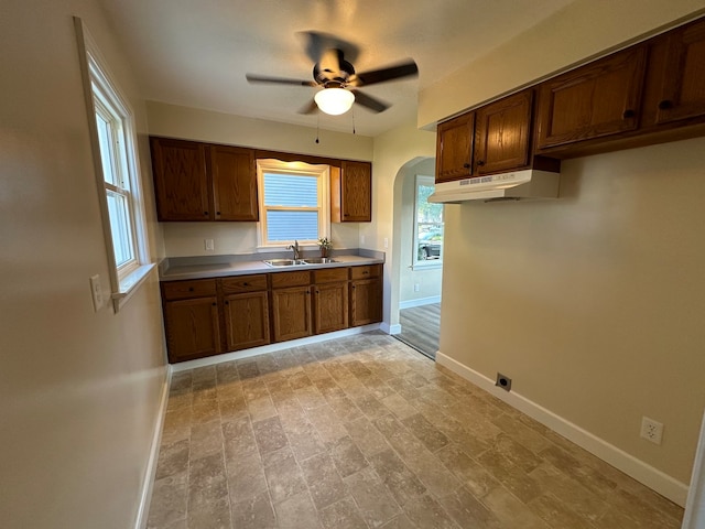 kitchen featuring sink, light hardwood / wood-style flooring, and ceiling fan