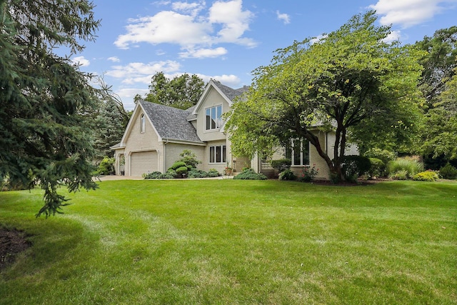 view of front facade featuring a front lawn and a garage