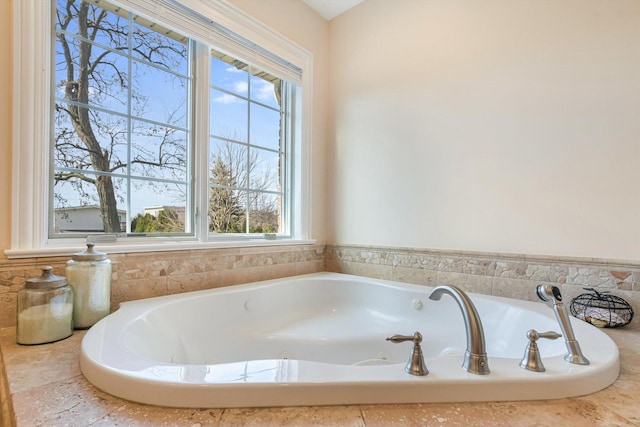 full bathroom featuring a whirlpool tub