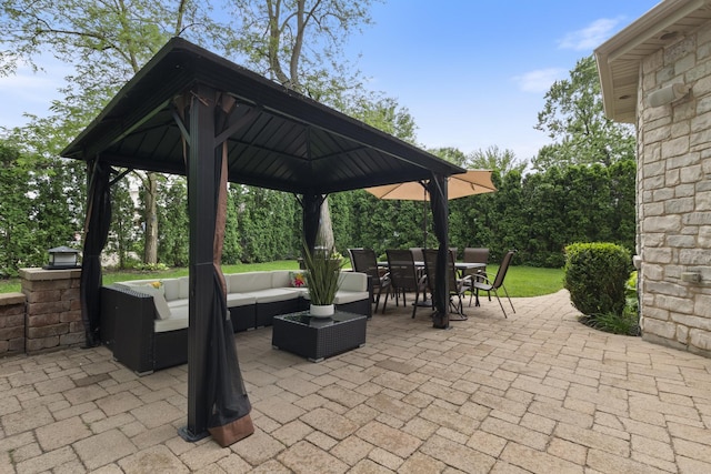 view of patio with outdoor lounge area, a gazebo, and outdoor dining space