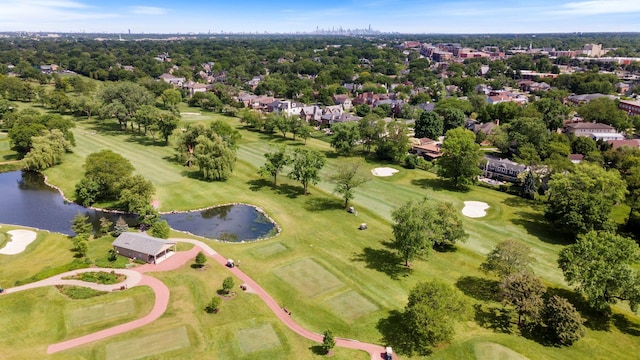 birds eye view of property featuring a water view and view of golf course