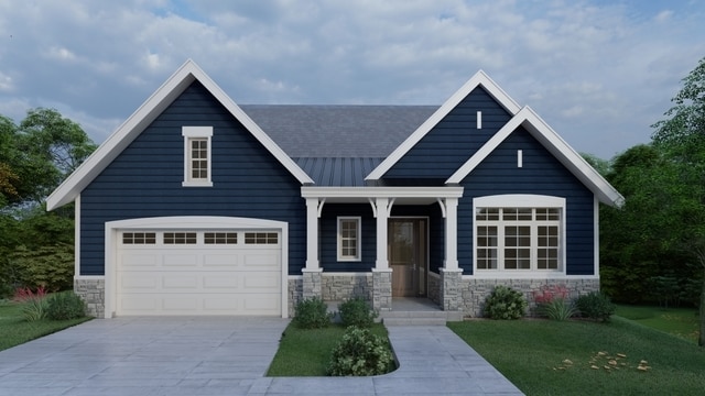 craftsman-style house with a garage and a front lawn