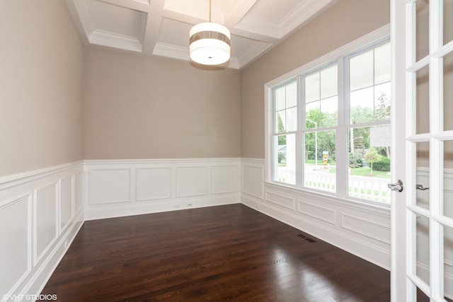 spare room with dark hardwood / wood-style flooring, beam ceiling, and coffered ceiling