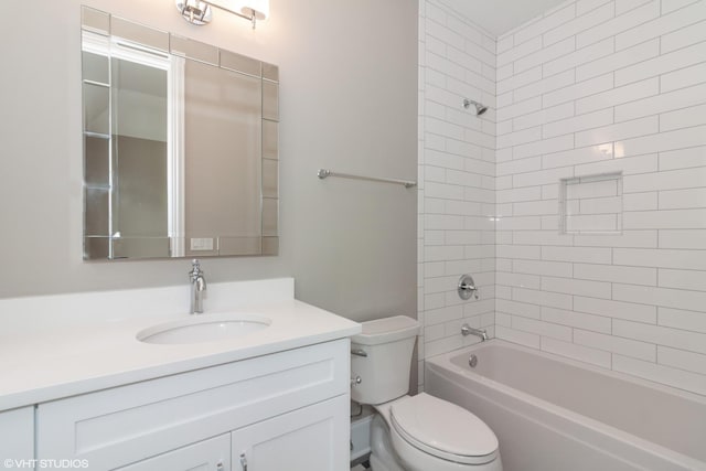 full bathroom with toilet, tiled shower / bath combo, and vanity