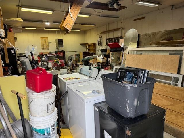 clothes washing area with washing machine and clothes dryer