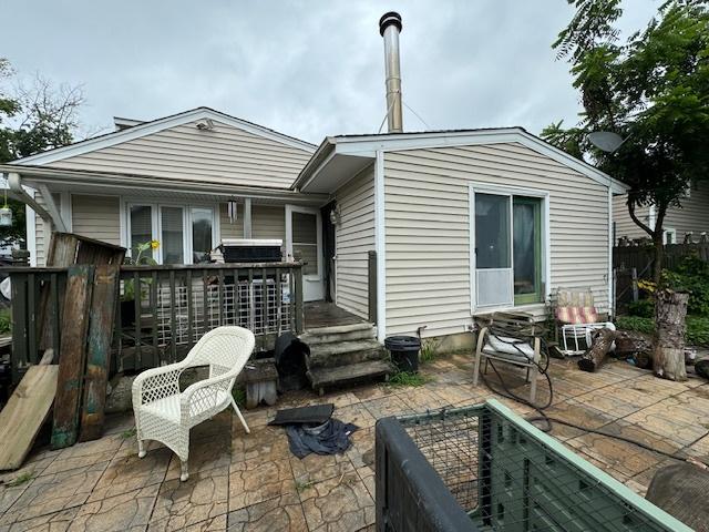 rear view of property featuring a patio