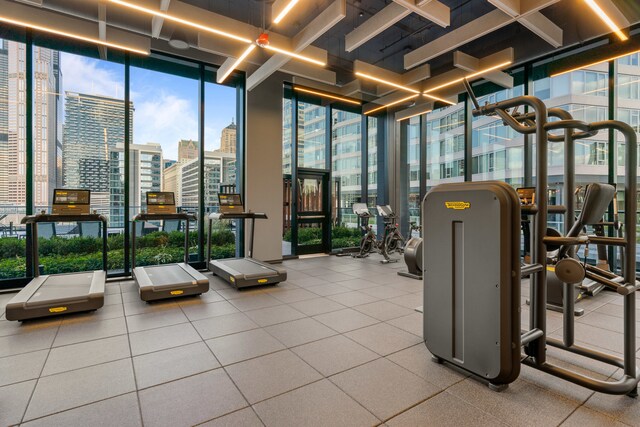 workout area featuring floor to ceiling windows