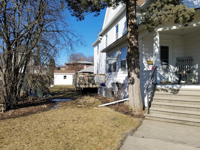 view of side of home featuring a deck