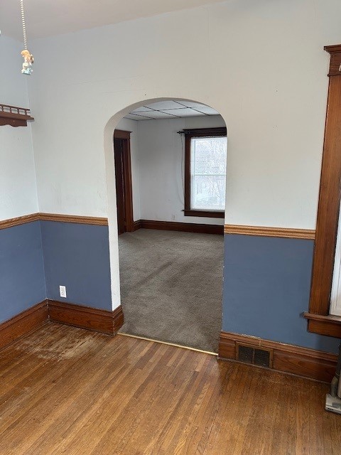 unfurnished room featuring wood-type flooring