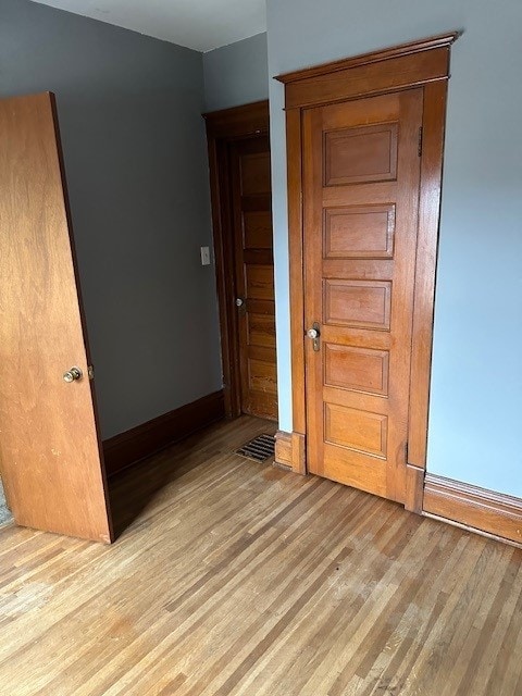 unfurnished bedroom with light hardwood / wood-style floors