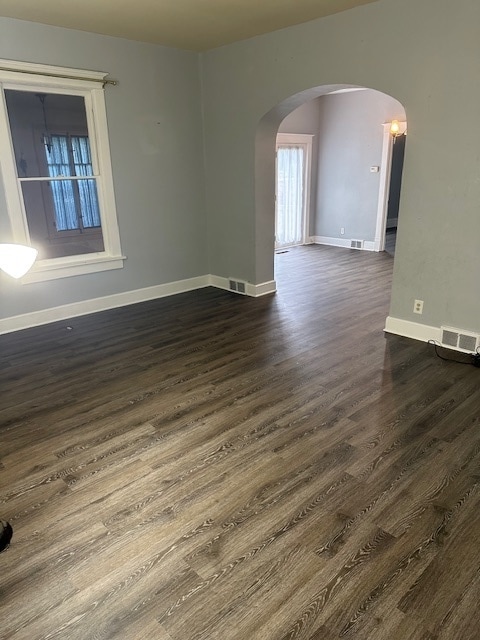 empty room featuring wood-type flooring