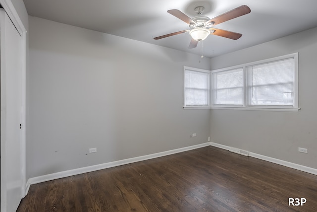 empty room with ceiling fan and hardwood / wood-style floors