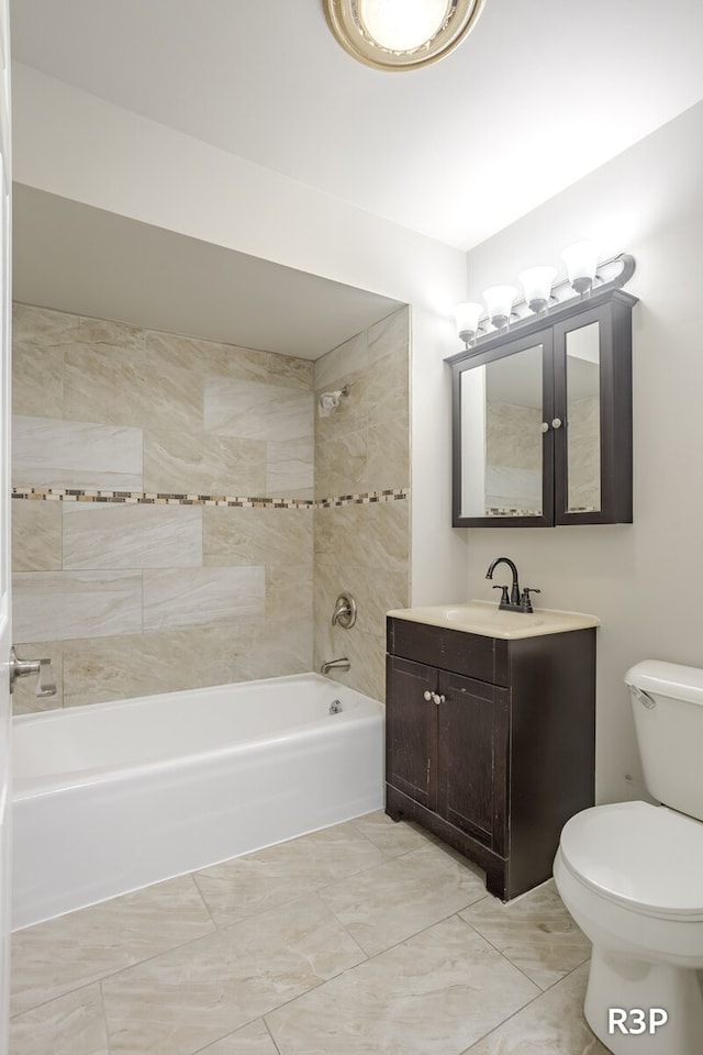 full bathroom with tiled shower / bath combo, tile patterned flooring, toilet, and vanity