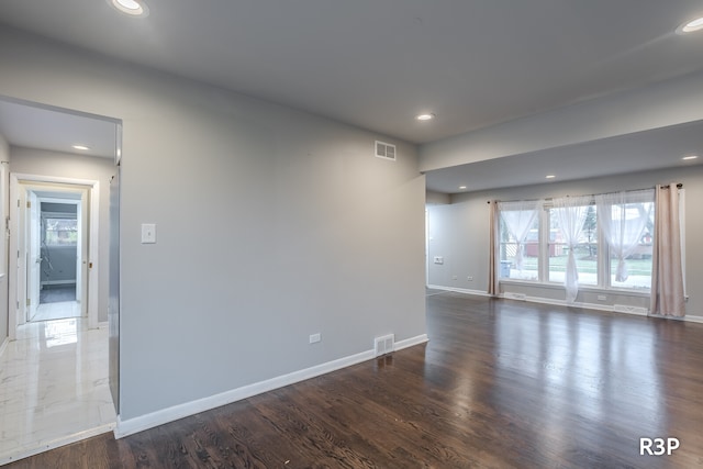 unfurnished room featuring hardwood / wood-style floors