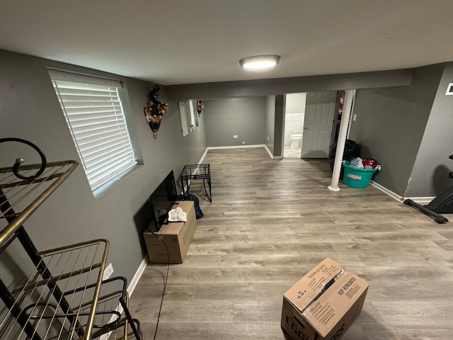 hallway with hardwood / wood-style flooring