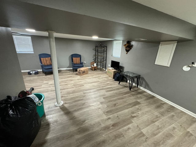 basement featuring light hardwood / wood-style floors and plenty of natural light