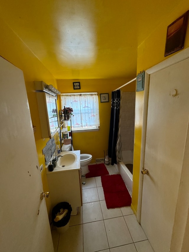 full bathroom featuring tile patterned flooring, toilet, vanity, and shower / bathtub combination with curtain