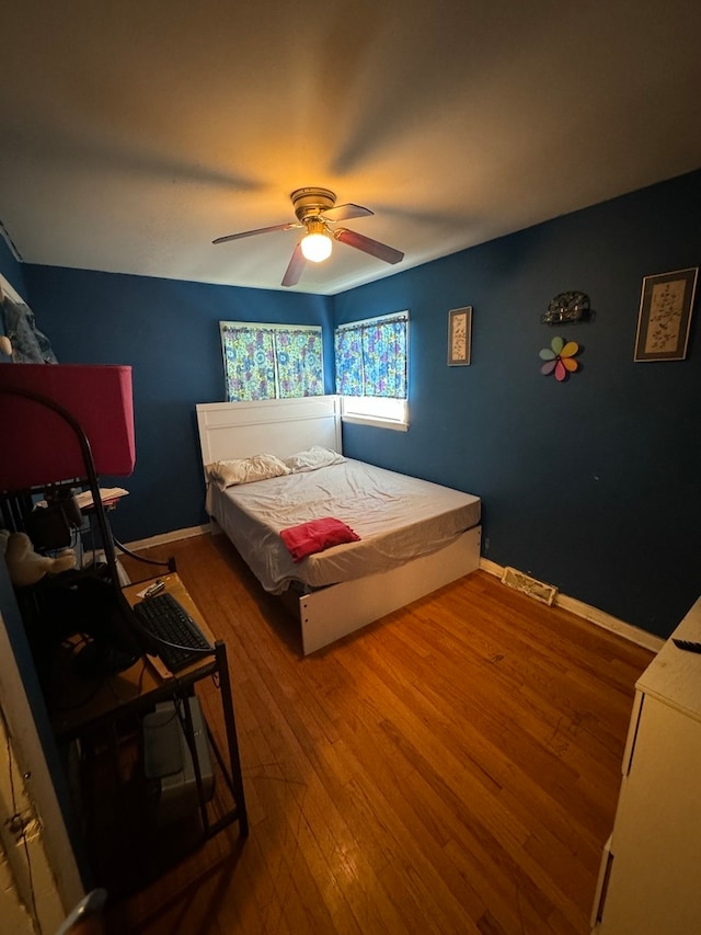 bedroom featuring ceiling fan and hardwood / wood-style floors