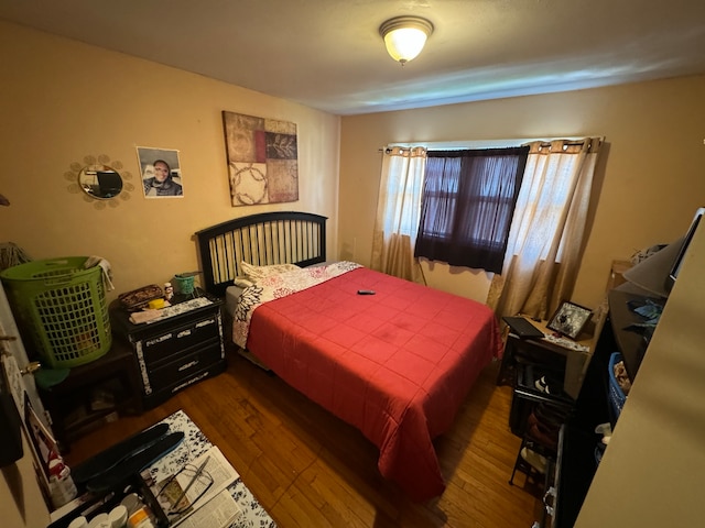 bedroom featuring dark hardwood / wood-style floors