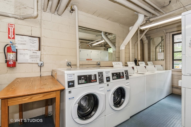 washroom with independent washer and dryer