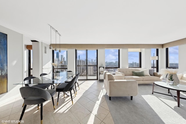 living room featuring light tile patterned floors, a view of city, and plenty of natural light