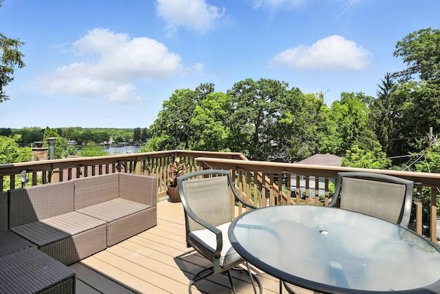 28629 W Ravine Dr, Barrington, IL 60010 - deck featuring outdoor lounge area, outdoor dining space, view of wooded area, and a water view
