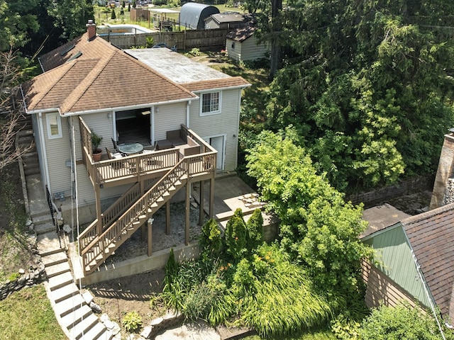 28629 W Ravine Dr, Barrington, IL 60010 - back of property with a wooden deck, stairway, and roof with shingles